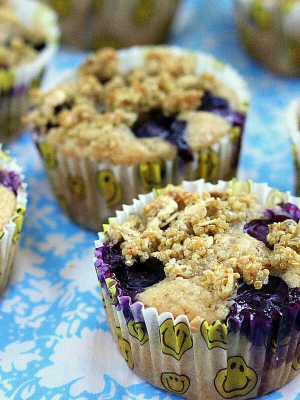 Lemon Blueberry Multigrain Muffins on a blue and white tablecloth
