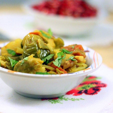 Brussel sprouts and potato served in a white bowl