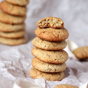 Satsuma multigrain cookies stacked on parchment paper