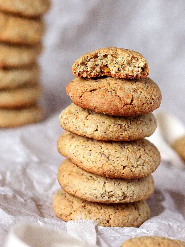 Satsuma multigrain cookies stacked on parchment paper