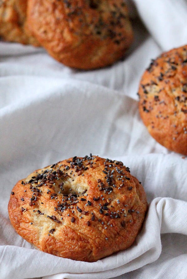 Wheat bagels placed on white fabric