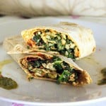 A cauliflower wrap cut in half and stacked