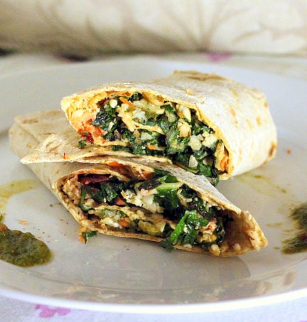 A cauliflower wrap cut in half and stacked