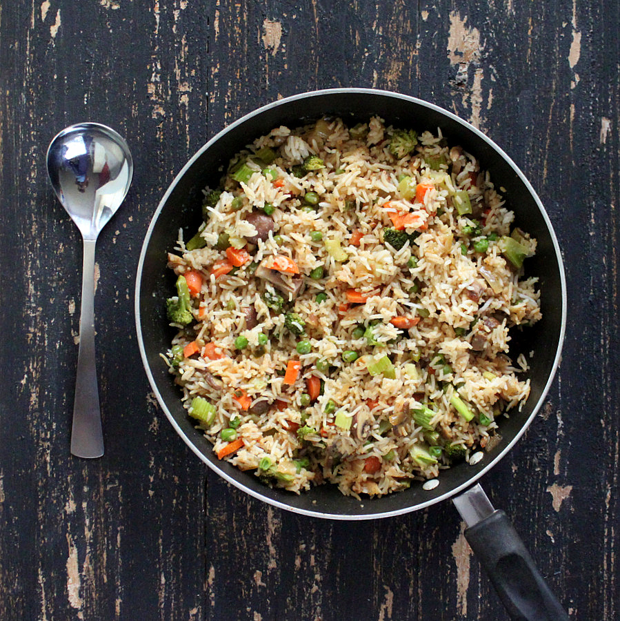 Vegan Garlic Fried Rice with Celery, Mushrooms, Broccoli, Bell Peppers, Carrots and Peas. Glutenfree Vegan Recipe