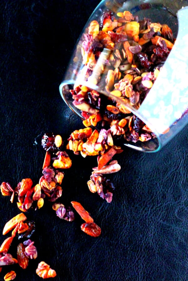 Berry Granola spilling out of a tumbler