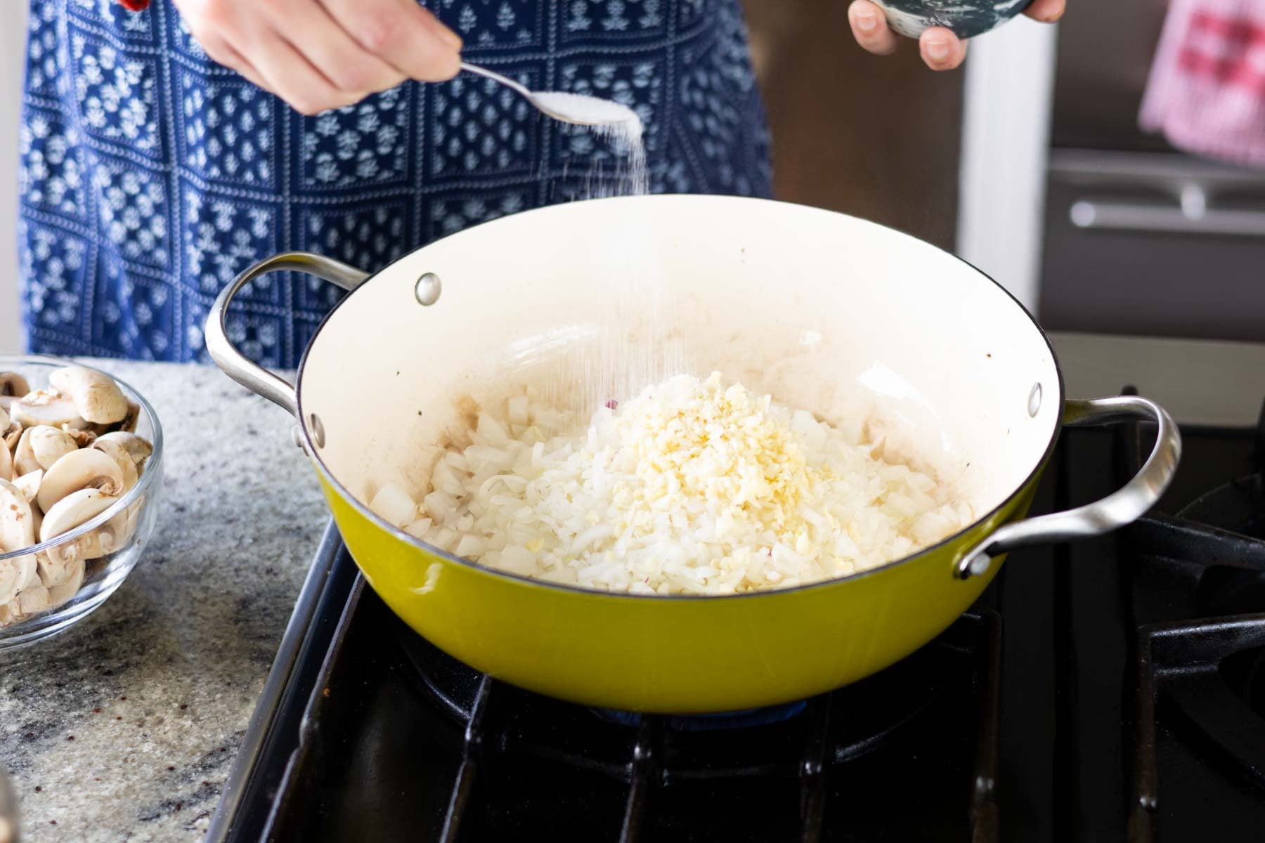 adding onion and salt to the pan