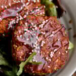 BBQ lentil burger patties served on a salad