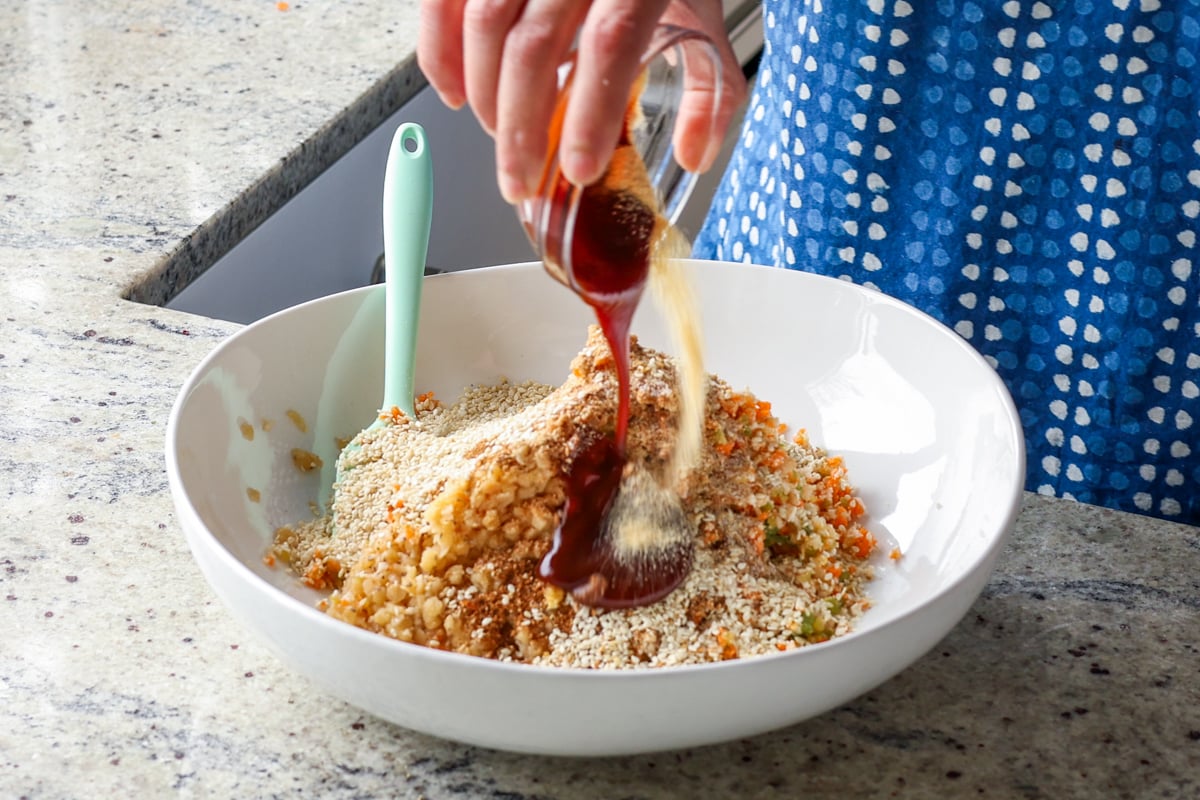 adding BBQ sauce to the lentil mixture
