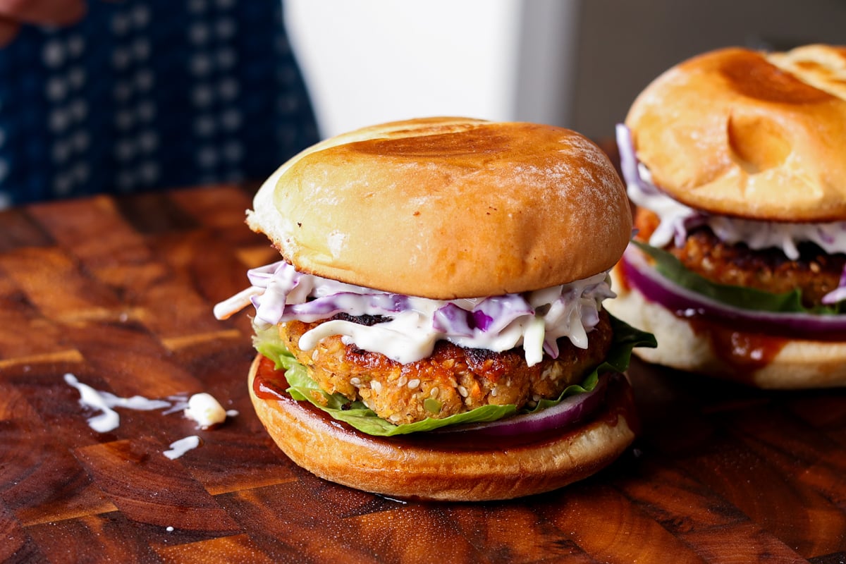 BBQ lentil burger in a bun with slaw