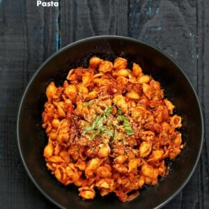 Overhead of chickpea chorizo pasta in a black bowl