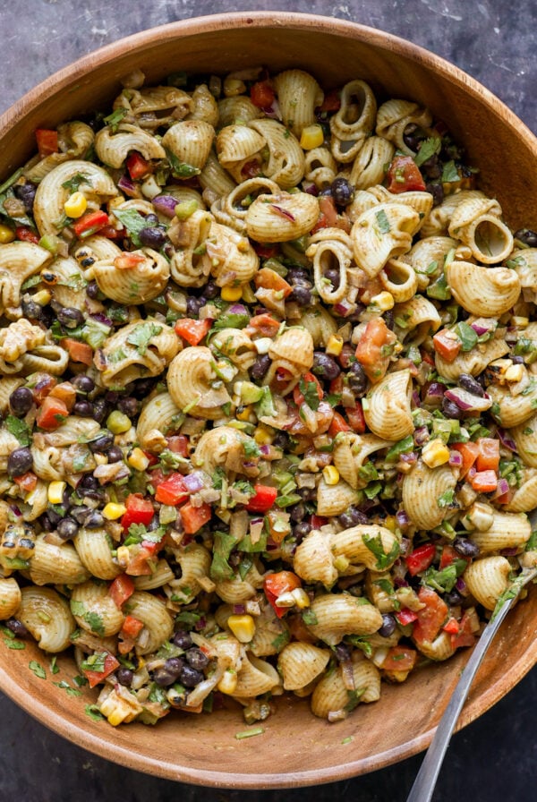 Southwestern pasta salad in a wooden bowl.