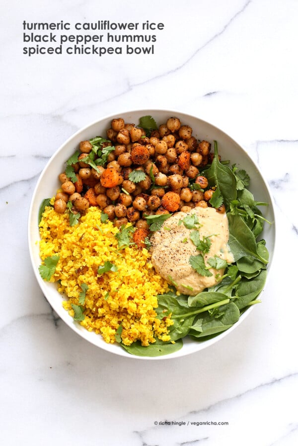 Turmeric Cauliflower Rice, Spiced Chickpeas or lentils, Black pepper hummus and Greens bowl. Amazing Flavors for any meal. Ready within 25 minutes. Vegan Gluten-free Soy-free Recipe | VeganRicha.com #glutenfree #veganricha #vegan