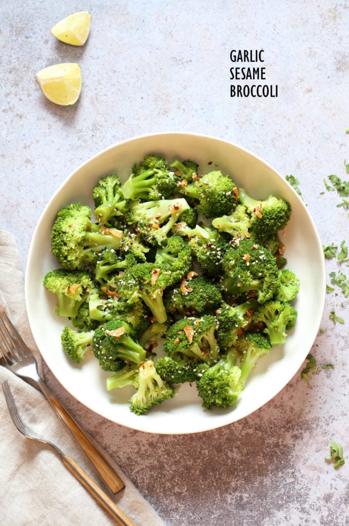 Sesame Garlic Broccoli needs just 6 ingredients. It is vibrant with blanched broccoli and delicious with a simple dressing of garlic roasted with sesame oil. A perfect side. #Vegan #glutenfree #soyfree #nutfree #veganricha #recipe