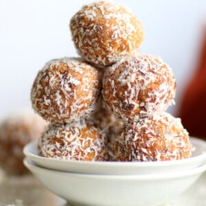 Easy Vegan Carrot Cake Bites Recipe! These Spiced Nut and Carrot Cake Balls Need just 8 ingredients and 15 minutes. Grainfree Carrot Cake Bliss Balls. Roll in coconut or dress with vegan cream cheese glaze. #CarrotCakeBites #Vegan #Glutenfree #Grainfree #Soyfree #healthy #VeganRicha VeganRicha.com