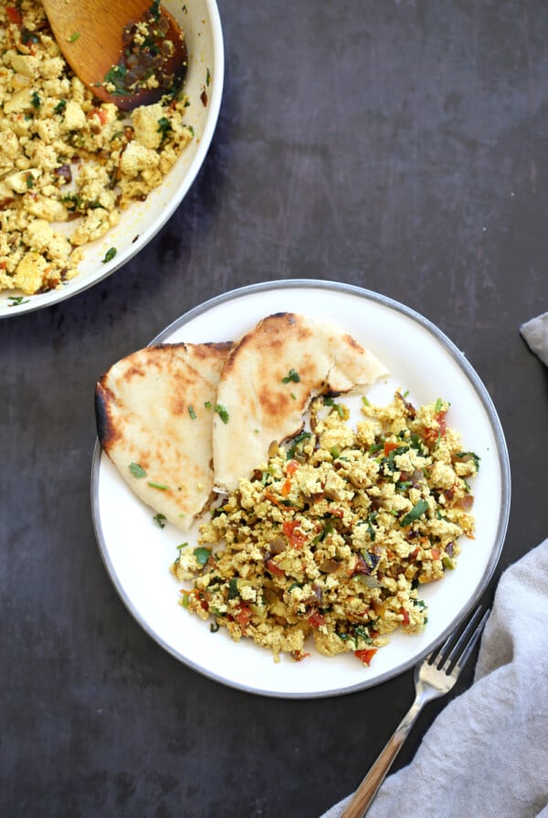 Tofu Bhurji - Vegan Bhurji or Akoori . Indian Scrambled eggs. Tofu scrambled with onion, tomato, cilantro and cumin for a delicious Eggless Bhurji Scramble Breakfast. #Vegan #Glutenfree #Nutfree #Recipe #VeganRicha #indianRecipe #tofuburji Can be soyfree.ย