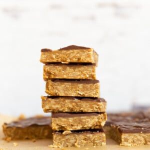 Sliced Sunbutter Granola Bars stacked on wood board