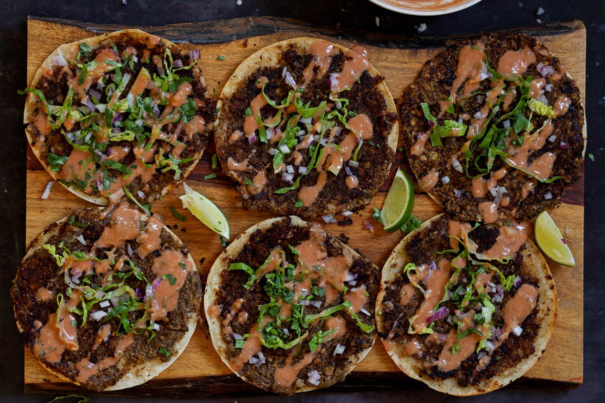 butter chicken smashed tacos on a serving tray