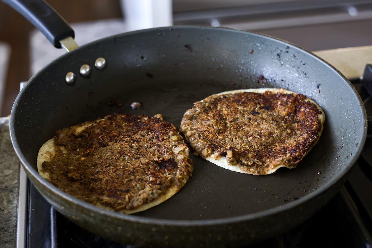 frying the tortilla side of the vegan smash burger tacos