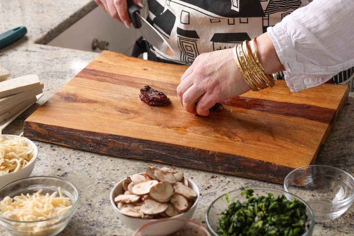 chopping the sun-dried tomato