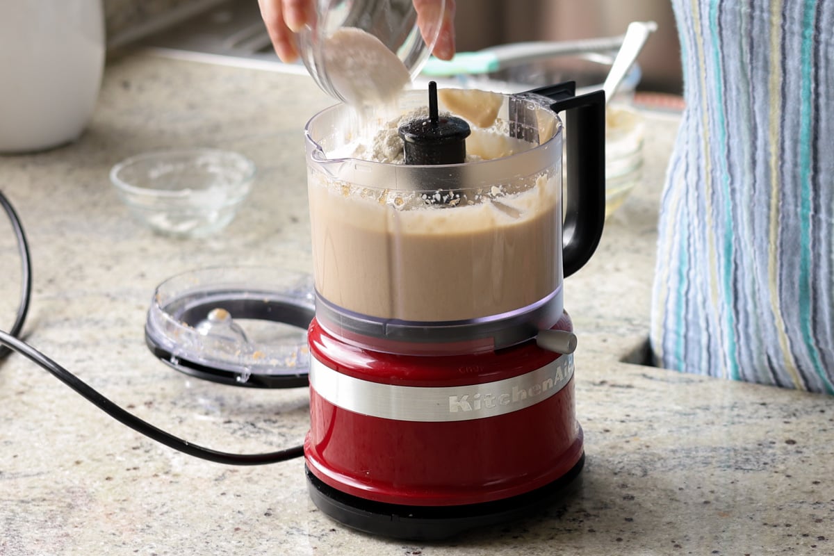 adding the dry ingredients to the food processor