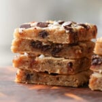 close-up of sliced white bean blondies on a cutting board, so you can see the texture inside