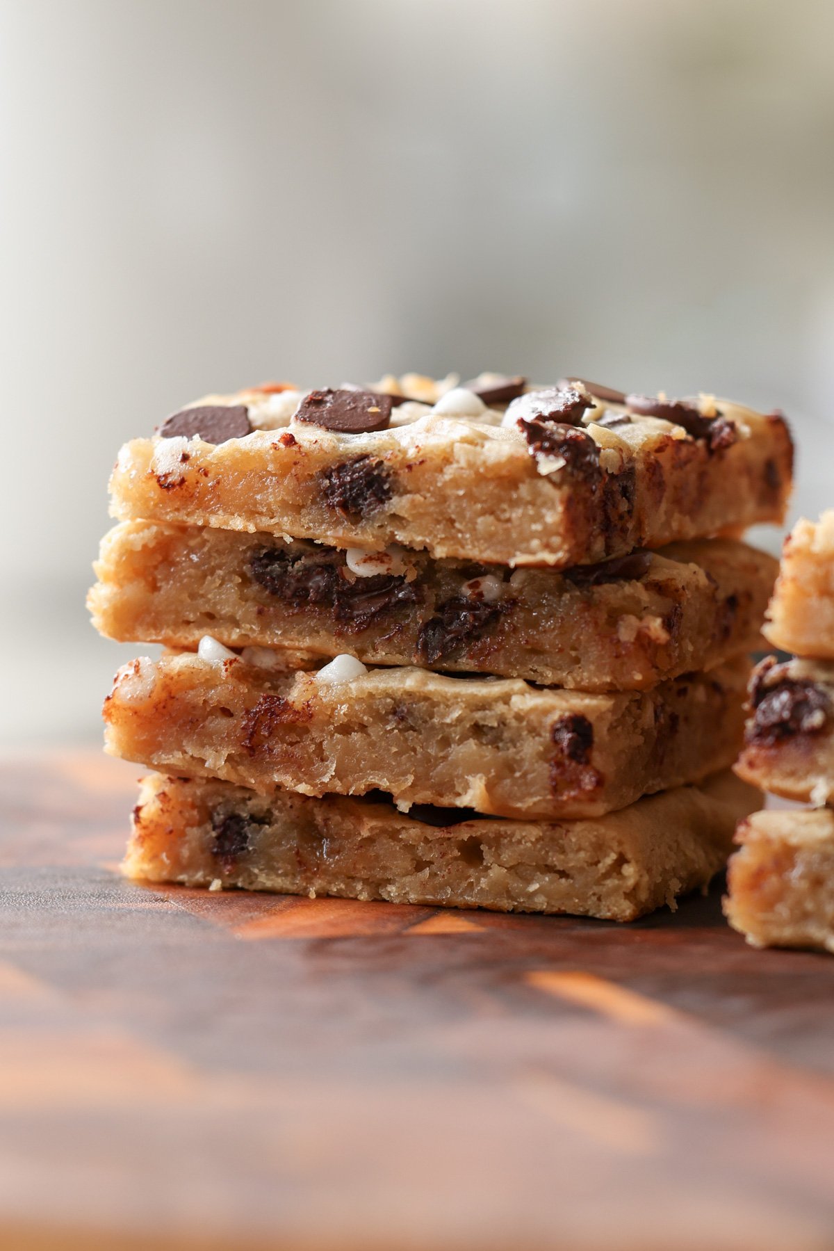 close-up of sliced white bean blondies on a cutting board, so you can see the texture inside