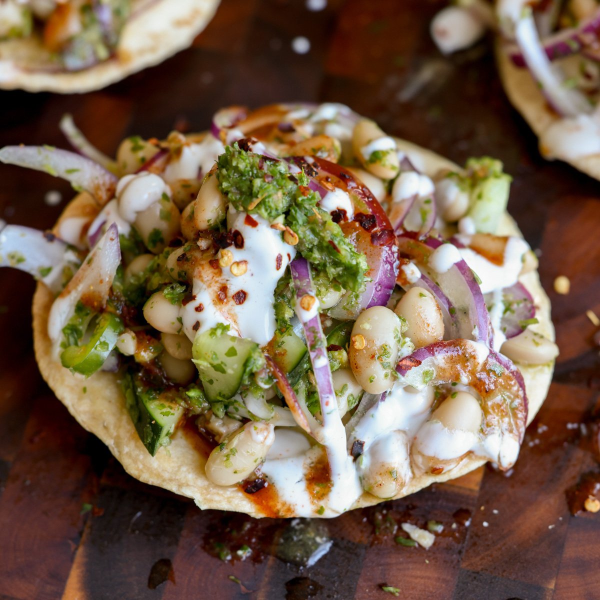 close-up of chutney bean tostadas on the cutting board