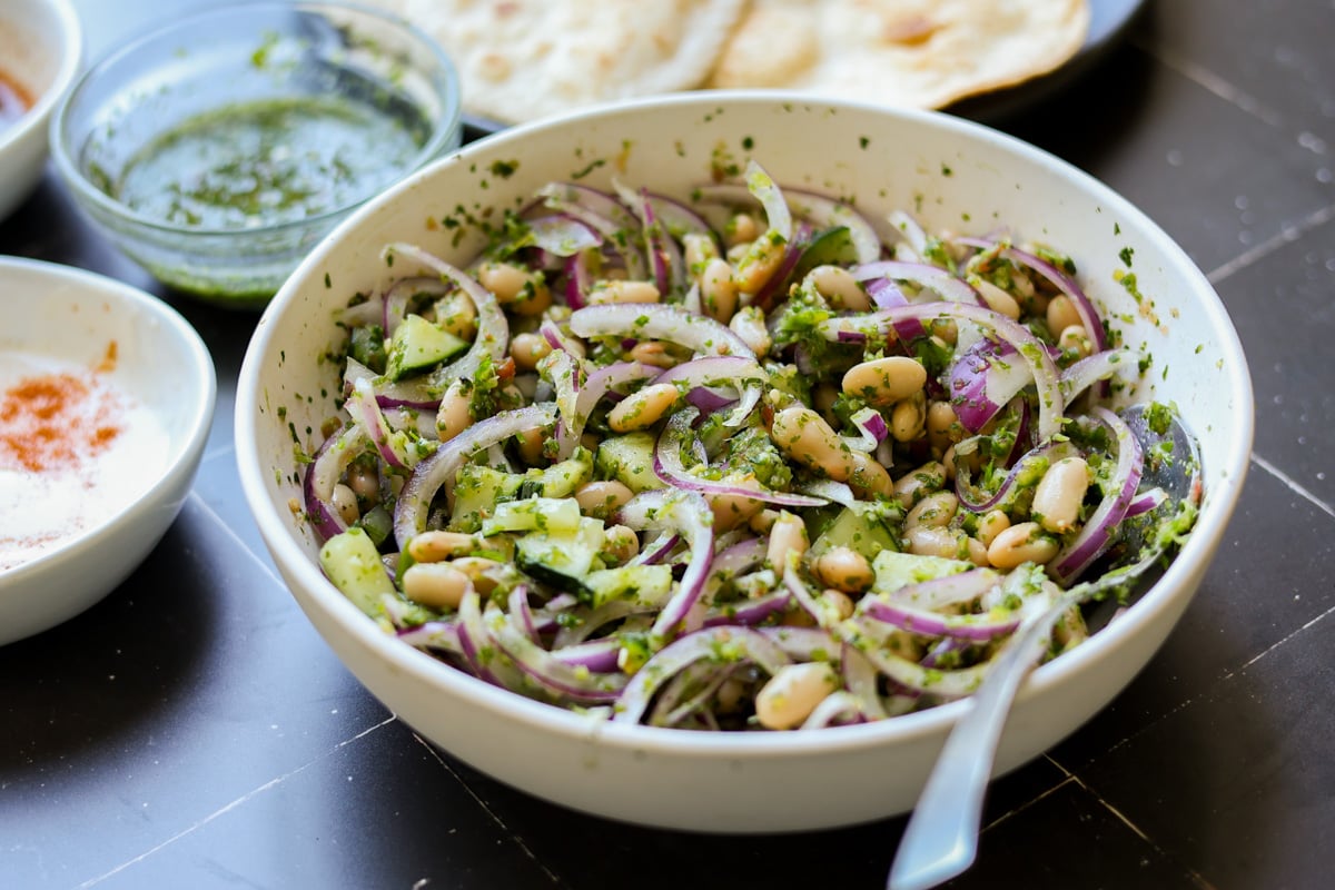 marinating white beans and veggies in green chutney