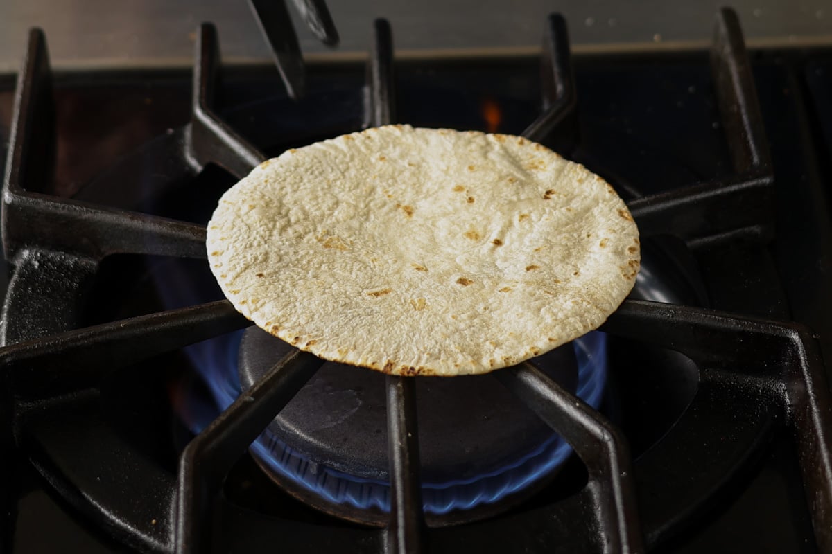 warming the tortilla on the stovetop