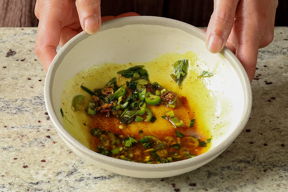 tadka after adding the oil and ground spices to the bowl