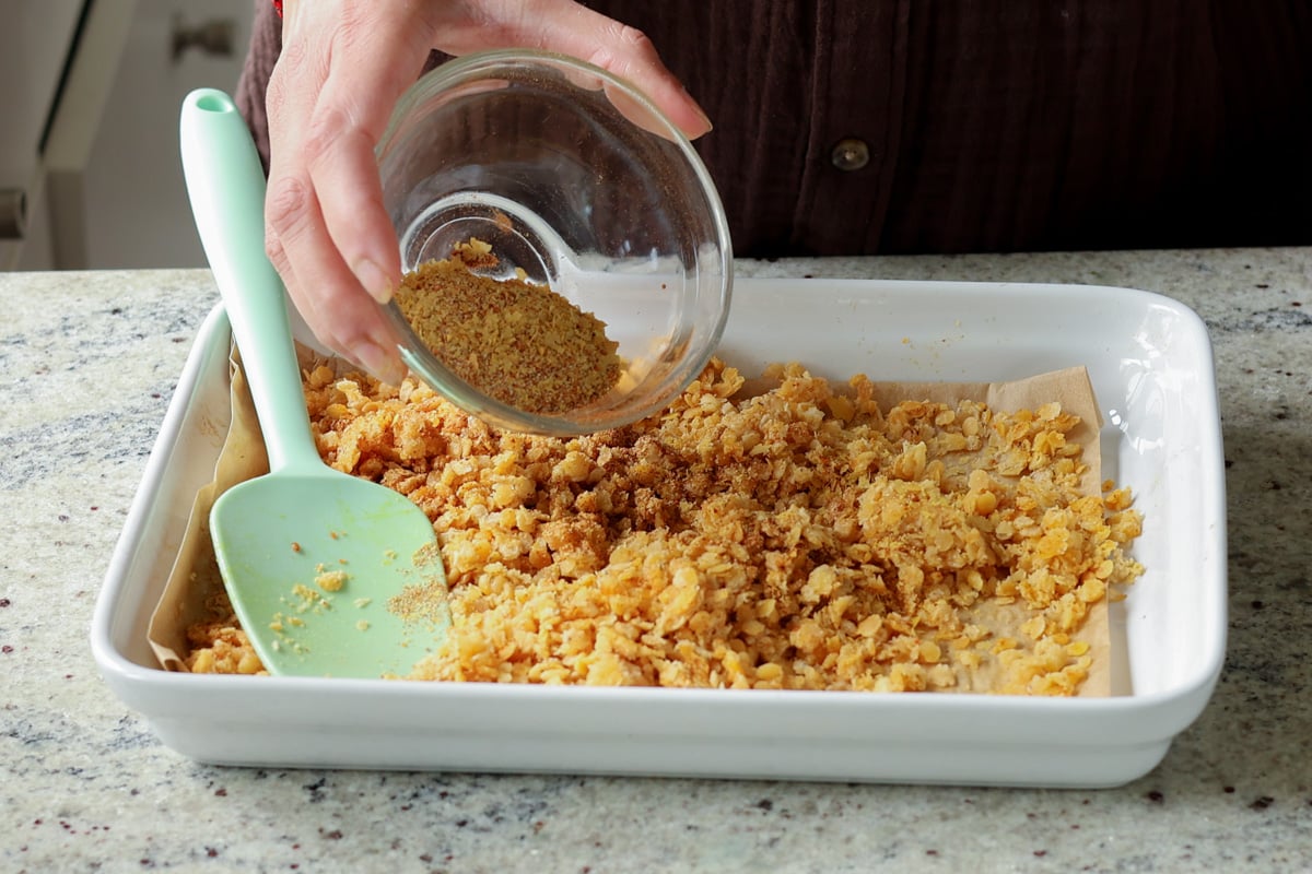 adding nacho cheese spice mix to the pan