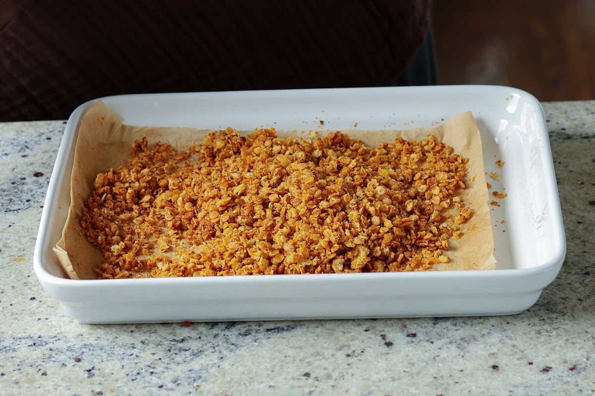 nacho cheese granola on the baking sheet after baking
