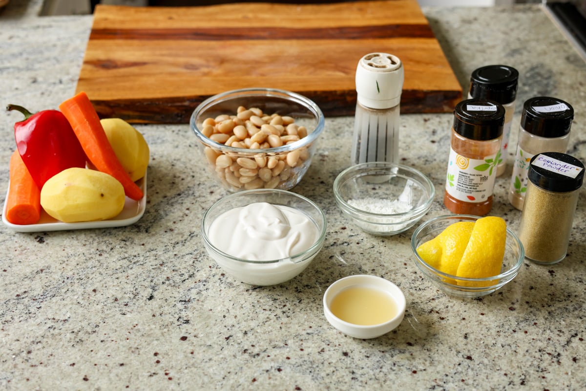 ingredients for sheet pan veggies and beans on the kitchen counter
