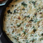 close-up of spinach artichoke gnocchi in the pan