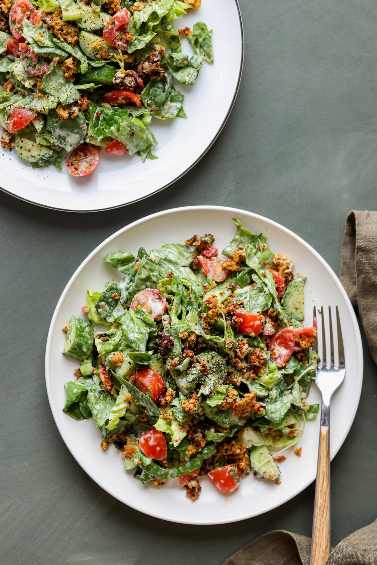 plates of summer spinach salad with chickpea olive