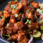 tofu majestic in a bowl with laccha onions