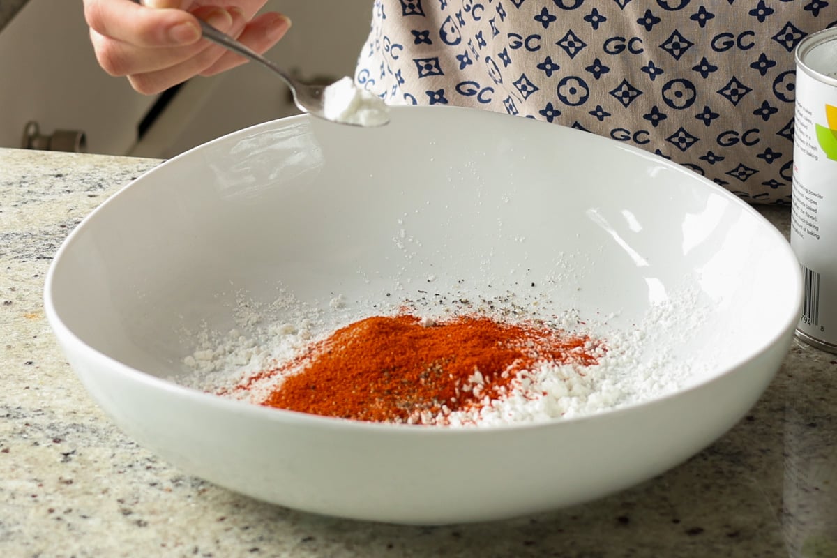 adding dry ingredients to the bowl