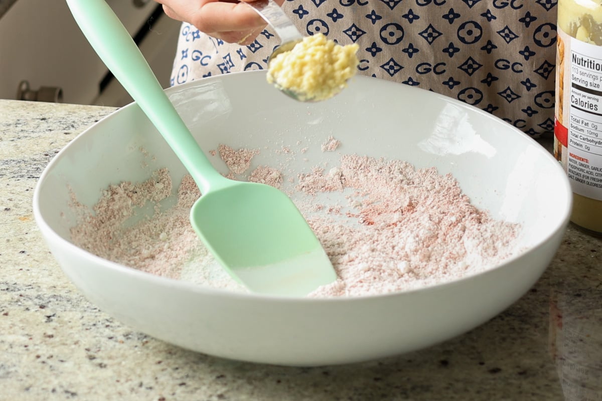 adding wet ingredients to the bowl