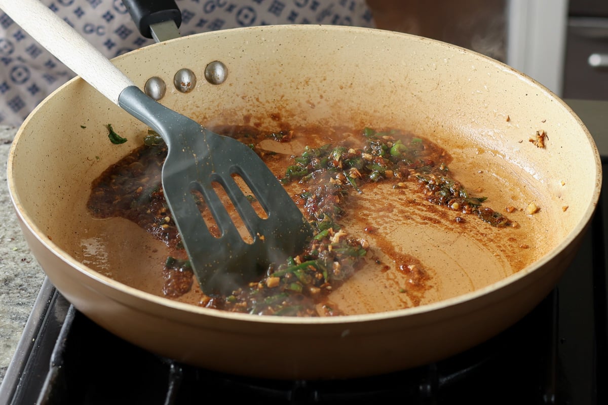 adding sauces to the pan