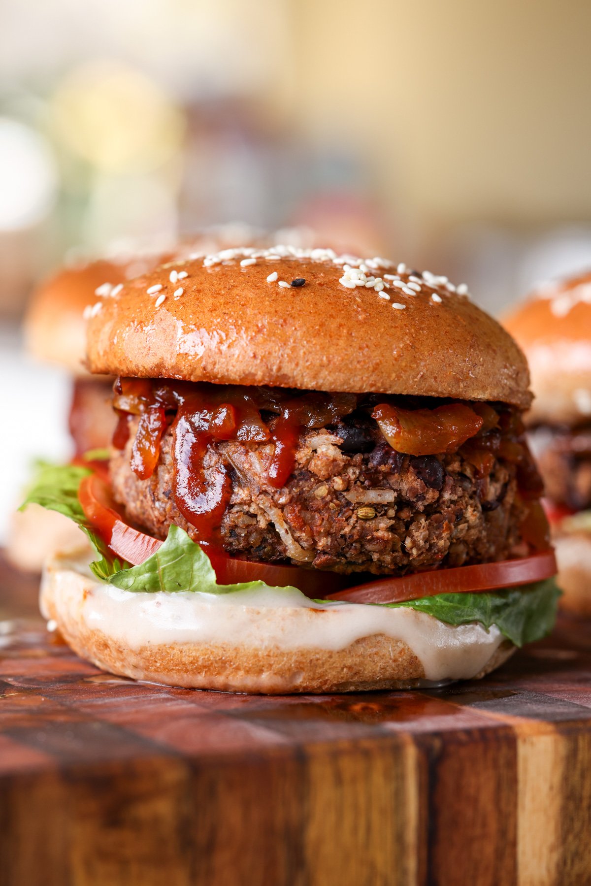 Black bean sunflower burger on a wooden cutting board.