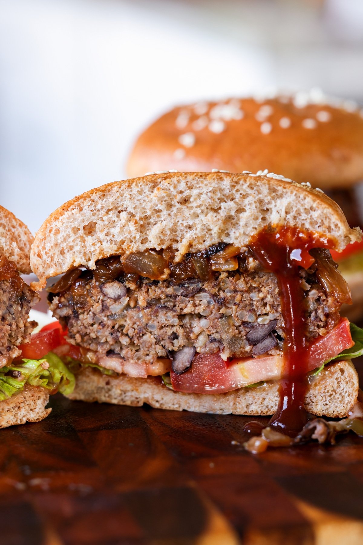 Black bean sunflower seed burger cut in half.