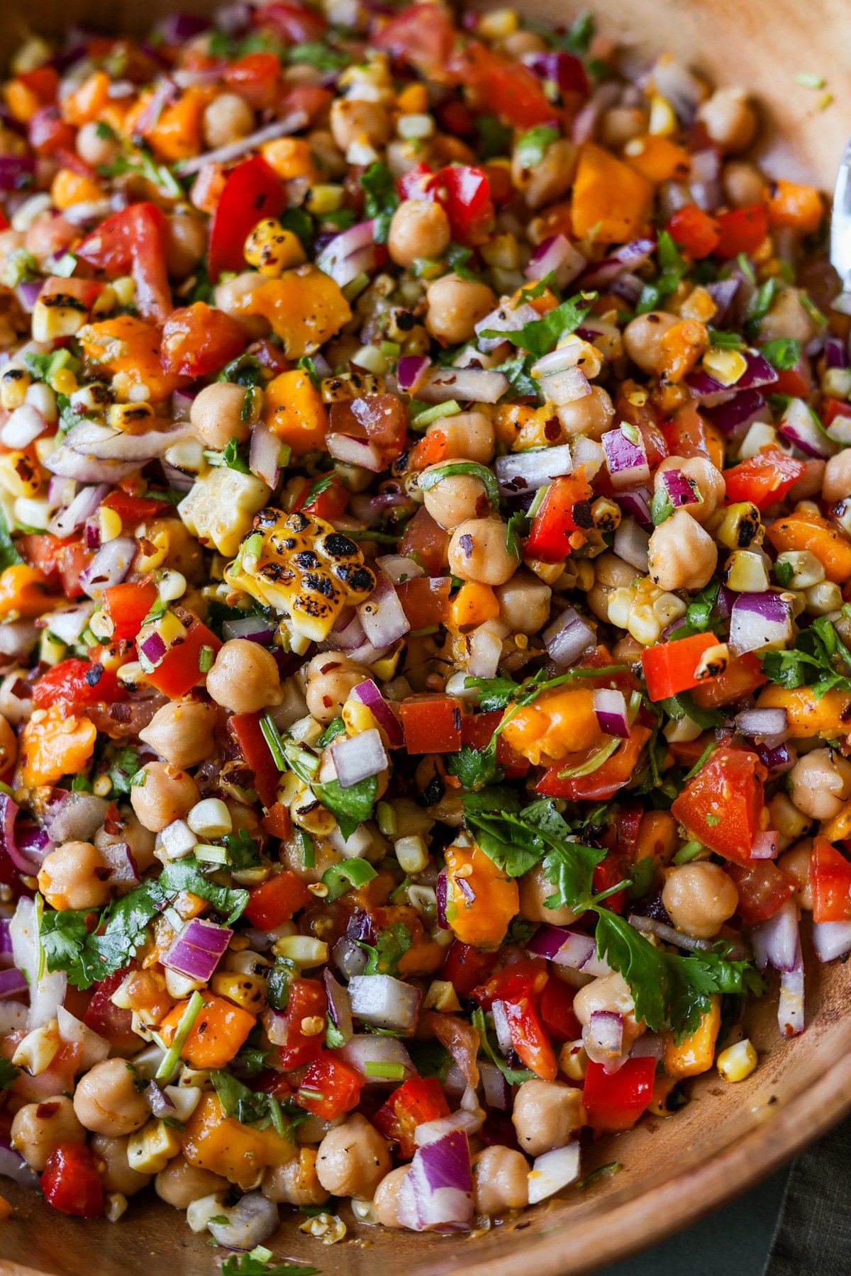 close-up of mango chickpea salad in a serving bowl
