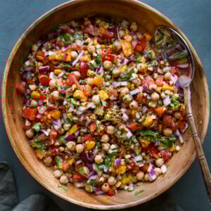 mango chickpea salad in a serving bowl with a spoon