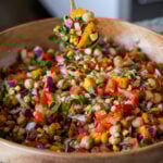 spoon serving up mango chickpea salad