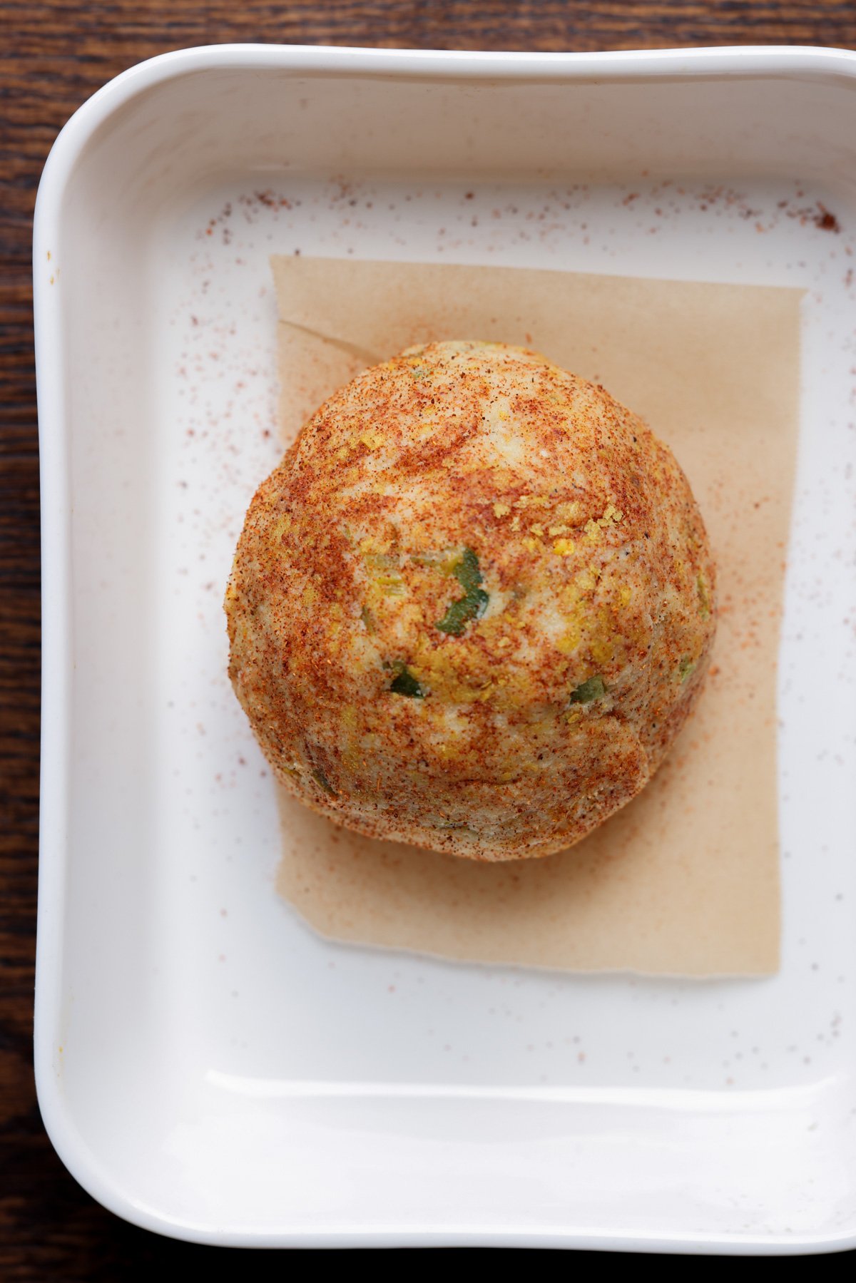 jalapeno popper cheese ball in the baking pan after baking