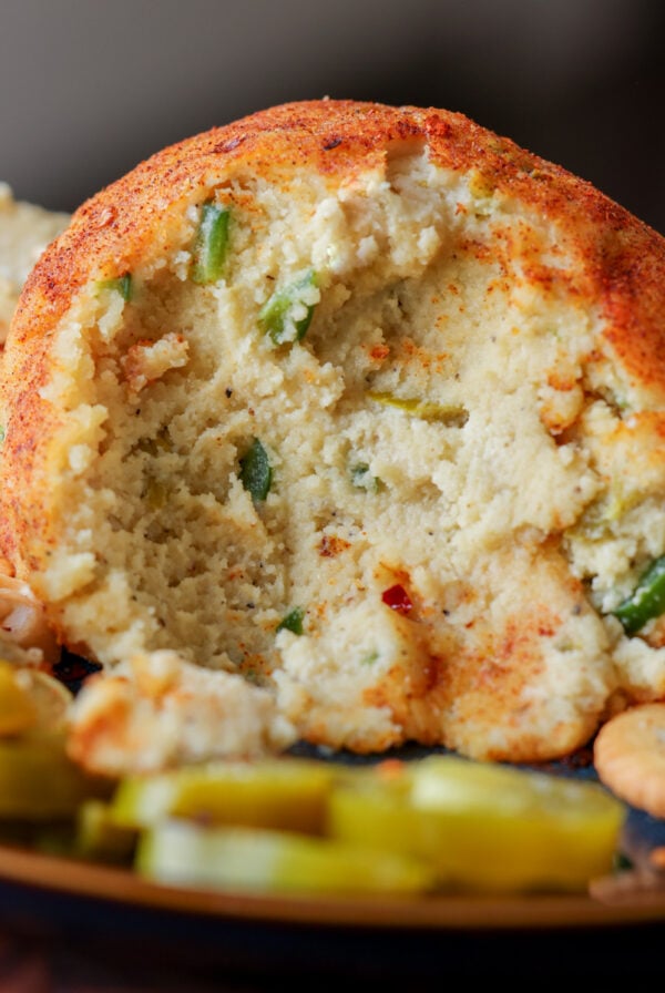 jalapeno popper cheese ball with scoops taken out, so you can see the inside texture