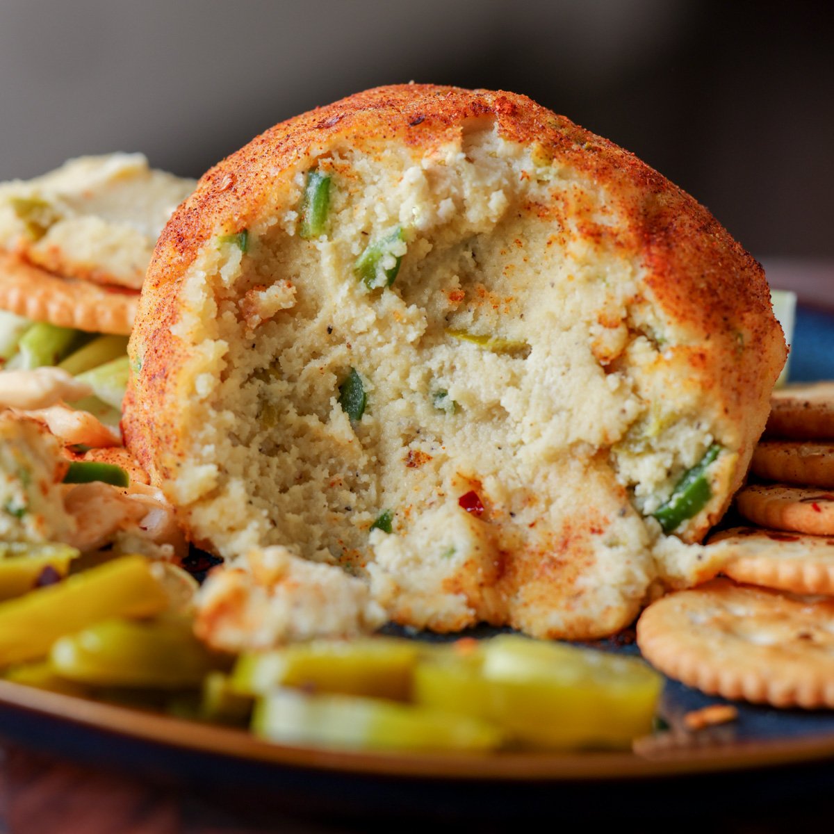 jalapeno popper cheese ball with scoops taken out, so you can see the inside texture