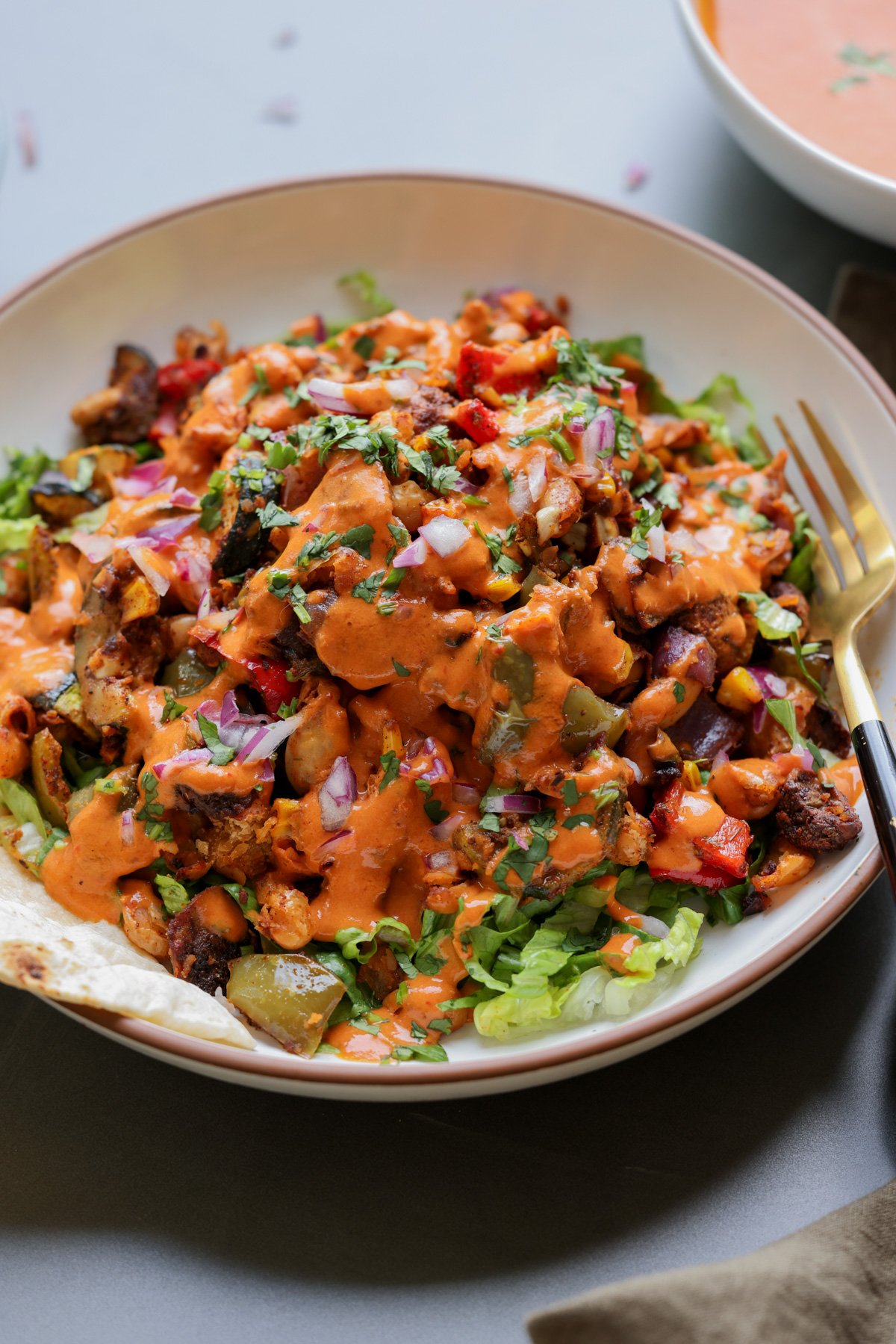 cajun sheet pan beans veggies in a bowl