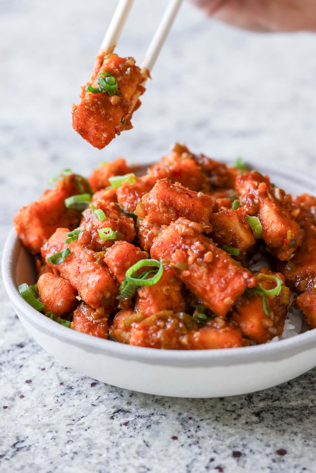 fork taking a bite of tofu Manchurian