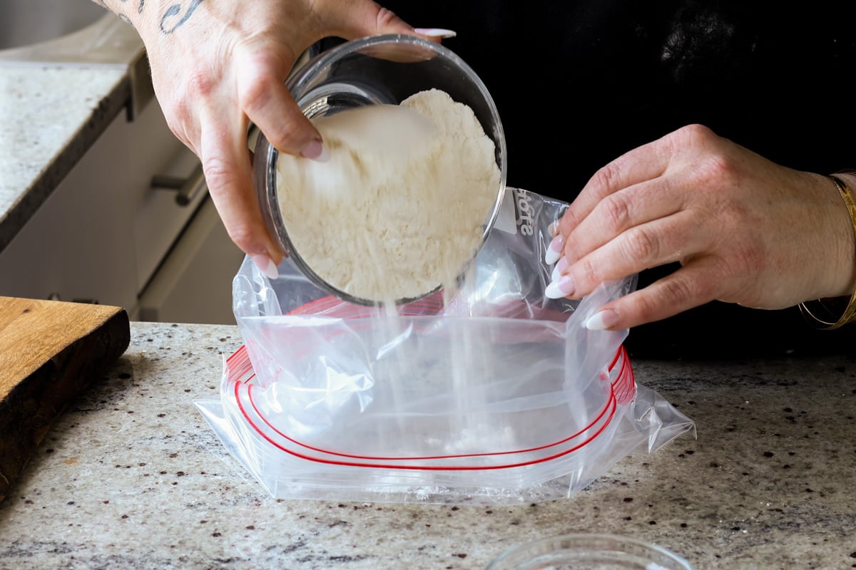 adding the coating mixture to a zip top bag